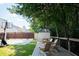 Well manicured backyard with a basketball court, shed, and a raised wooden patio at 3050 Baymount Dr, Lawrenceville, GA 30043