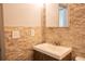 Bathroom featuring vanity sink with decoratiive stone accent wall at 3050 Baymount Dr, Lawrenceville, GA 30043