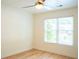 Bedroom featuring hardwood floors, ceiling fan and bright window at 3050 Baymount Dr, Lawrenceville, GA 30043