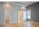 Bright bedroom featuring a sliding barn door to the bathroom at 3050 Baymount Dr, Lawrenceville, GA 30043