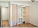 Bedroom featuring hardwood floors, closet and interior door at 3050 Baymount Dr, Lawrenceville, GA 30043