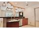 Kitchen featuring granite countertops, stainless steel appliances, and pendant lighting, with a sink area at 3050 Baymount Dr, Lawrenceville, GA 30043
