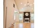 Spacious living room featuring hardwood floors, a fireplace with a mirror, and ample natural light at 3050 Baymount Dr, Lawrenceville, GA 30043