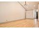 Bright, open living room with hardwood floors, neutral walls, and modern lighting fixtures at 3050 Baymount Dr, Lawrenceville, GA 30043