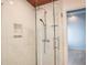 Elegant shower with a marble tiled wall and high-end shower fixtures at 3050 Baymount Dr, Lawrenceville, GA 30043