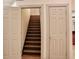 Staircase view featuring hardwood steps and access to a closet at 3050 Baymount Dr, Lawrenceville, GA 30043