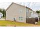 Exterior view of the side of the home showcasing the siding, windows, and fenced-in yard at 3375 Highbury Way, Lithonia, GA 30038