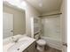 Full bathroom with a single vanity, a toilet and a shower over tub with tiled walls and tile flooring at 3375 Highbury Way, Lithonia, GA 30038