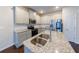 Modern kitchen featuring granite countertops, stainless steel appliances, and center island with sink at 3375 Highbury Way, Lithonia, GA 30038