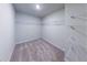 Empty walk-in closet with carpet and shelving ready for organizing your wardrobe at 3375 Highbury Way, Lithonia, GA 30038