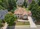 Beautiful home featuring mature landscaping, a two car garage, and charming front porch at 4054 Lyon Blvd, Atlanta, GA 30331