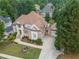 Beautiful home featuring mature landscaping, a two car garage, and charming front porch at 4054 Lyon Blvd, Atlanta, GA 30331