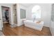 Luxurious bathroom featuring a soaking tub, walk-in shower, and modern fixtures at 4054 Lyon Blvd, Atlanta, GA 30331