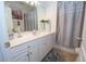Modern bathroom featuring a vanity with sink, and a shower and tub with gray accents at 4054 Lyon Blvd, Atlanta, GA 30331