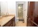 Bathroom featuring a marble shower, granite countertop and tiled floor at 4054 Lyon Blvd, Atlanta, GA 30331