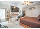 Spacious bedroom with a ceiling fan, a large TV, and a comfortable bed at 4054 Lyon Blvd, Atlanta, GA 30331