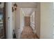 Inviting covered porch with brick flooring, white columns, and a charming wall sconce at 4054 Lyon Blvd, Atlanta, GA 30331