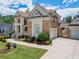Elegant home featuring brick and stucco, with a convenient two-car garage and well-maintained landscaping at 4054 Lyon Blvd, Atlanta, GA 30331