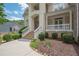 Home featuring a prominent front entrance with brick steps, white railings, and detailed trim at 4054 Lyon Blvd, Atlanta, GA 30331