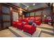 Comfortable home theater featuring plush seating, a projection screen, and tiered flooring at 4054 Lyon Blvd, Atlanta, GA 30331