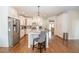 Bright kitchen with granite countertops, stainless steel appliances, a kitchen island and white cabinets at 4054 Lyon Blvd, Atlanta, GA 30331