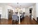 Spacious kitchen featuring a large center island with seating, stainless steel appliances, and white cabinetry at 4054 Lyon Blvd, Atlanta, GA 30331