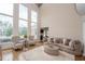 Bright living room featuring high ceilings, large windows, and modern furniture at 4054 Lyon Blvd, Atlanta, GA 30331