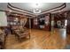 Spacious living room featuring a large entertainment center, wood floors, and recessed lighting at 4054 Lyon Blvd, Atlanta, GA 30331
