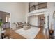 Open concept living room with staircase and second floor balcony, hardwood floors, and large windows at 4054 Lyon Blvd, Atlanta, GA 30331