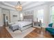 Comfortable main bedroom featuring a tray ceiling, carpet, and ample natural light at 4054 Lyon Blvd, Atlanta, GA 30331