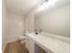 Bathroom featuring a vanity with marble countertop, a soaking tub, and shower at 4815 Price St, Forest Park, GA 30297
