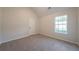 Bedroom with plush carpeting and natural light from a bright window at 4815 Price St, Forest Park, GA 30297