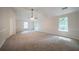 Bedroom featuring carpet, trim detail, and a ceiling fan at 4815 Price St, Forest Park, GA 30297