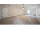 Spacious bedroom with neutral carpet, trim detail, and a ceiling fan at 4815 Price St, Forest Park, GA 30297