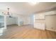 Dining area featuring wood flooring, a modern light fixture, and access to an open-concept space at 4815 Price St, Forest Park, GA 30297