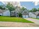 Charming two-story home with a manicured lawn and a two-car garage, nestled in a friendly neighborhood at 4815 Price St, Forest Park, GA 30297