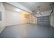 A spacious three-car garage with epoxy-coated floors for a clean and durable finish at 4815 Price St, Forest Park, GA 30297