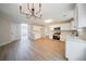 Bright and spacious kitchen with stainless steel appliances, white cabinets, and modern light fixture at 4815 Price St, Forest Park, GA 30297