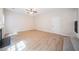 Cozy living room with new flooring, fireplace, and a ceiling fan, offering a comfortable space at 4815 Price St, Forest Park, GA 30297