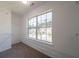 A walk-in closet with a large window overlooking the surrounding neighborhood at 4815 Price St, Forest Park, GA 30297