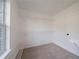 A walk-in closet features wire shelving and a window for natural light and ventilation at 4815 Price St, Forest Park, GA 30297