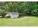 A fenced yard with mature trees and a storage shed at 180 Kim Trail Trl, Stockbridge, GA 30281