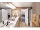 Bathroom features a double sink vanity and access to the bedroom with lots of natural light at 180 Kim Trail Trl, Stockbridge, GA 30281