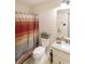 Bathroom featuring a toilet, sink, and shower at 180 Kim Trail Trl, Stockbridge, GA 30281