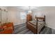 Bedroom with hardwood floors, a vintage dresser, and a crystal chandelier at 180 Kim Trail Trl, Stockbridge, GA 30281