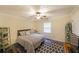 Bright bedroom with a ceiling fan, a window, and neutral décor for a relaxing atmosphere at 180 Kim Trail Trl, Stockbridge, GA 30281