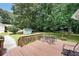Deck with a seating area perfect for relaxing and enjoying the view of the backyard at 180 Kim Trail Trl, Stockbridge, GA 30281