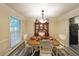 Cozy dining room with stylish decor, lighting, and a view of the outdoors at 180 Kim Trail Trl, Stockbridge, GA 30281