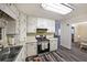 A charming kitchen featuring painted cabinets, stainless steel appliances, and durable flooring at 180 Kim Trail Trl, Stockbridge, GA 30281