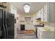 Well-lit kitchen featuring ample cabinets, modern appliances, and durable modern flooring at 180 Kim Trail Trl, Stockbridge, GA 30281